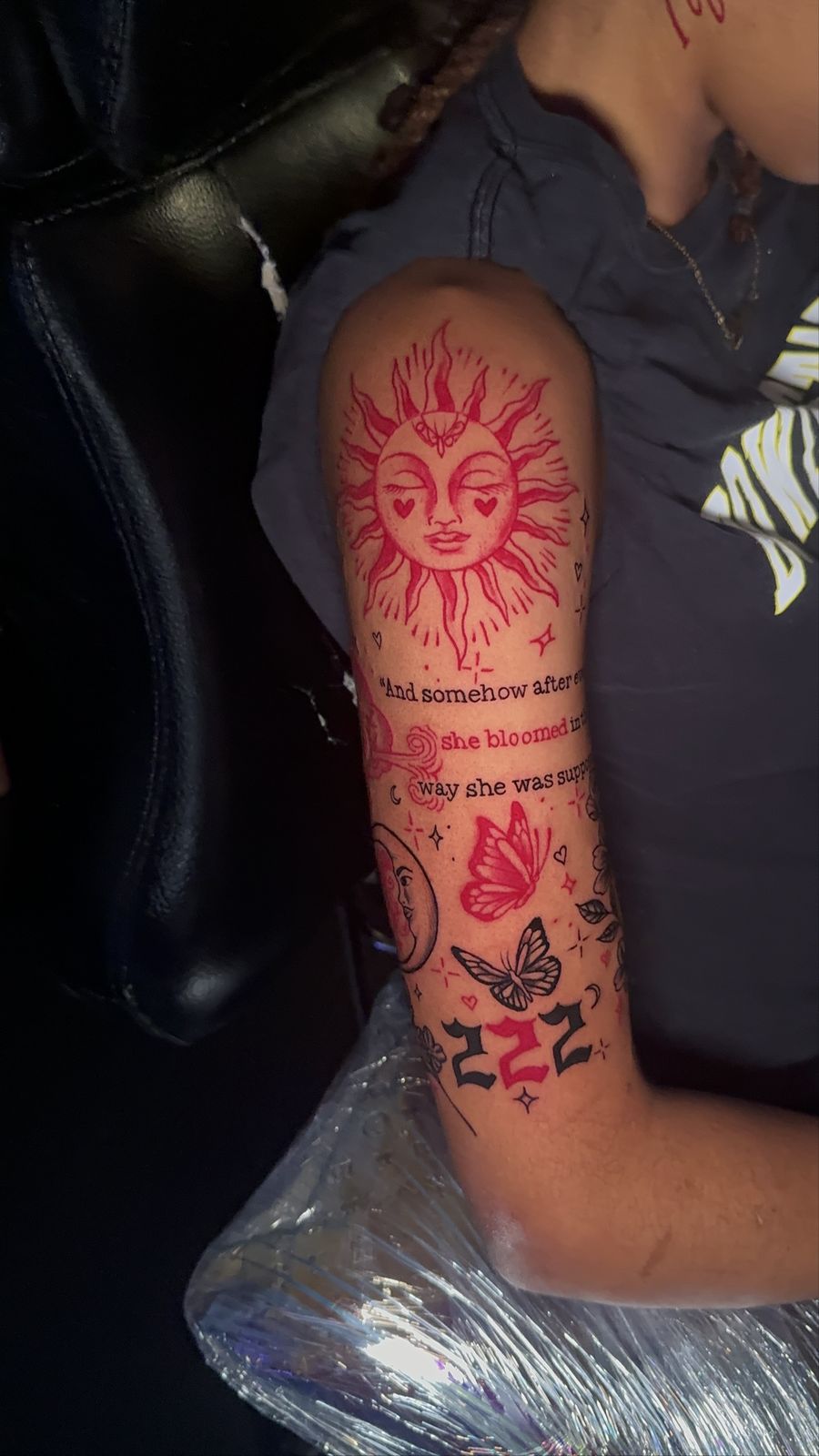 Red sun face with 222 and butterflies, forearm piece