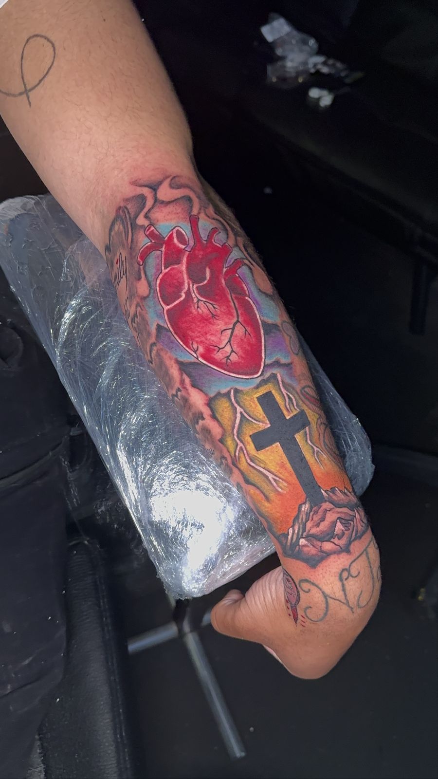 Anatomical heart with cross, colorful forearm piece