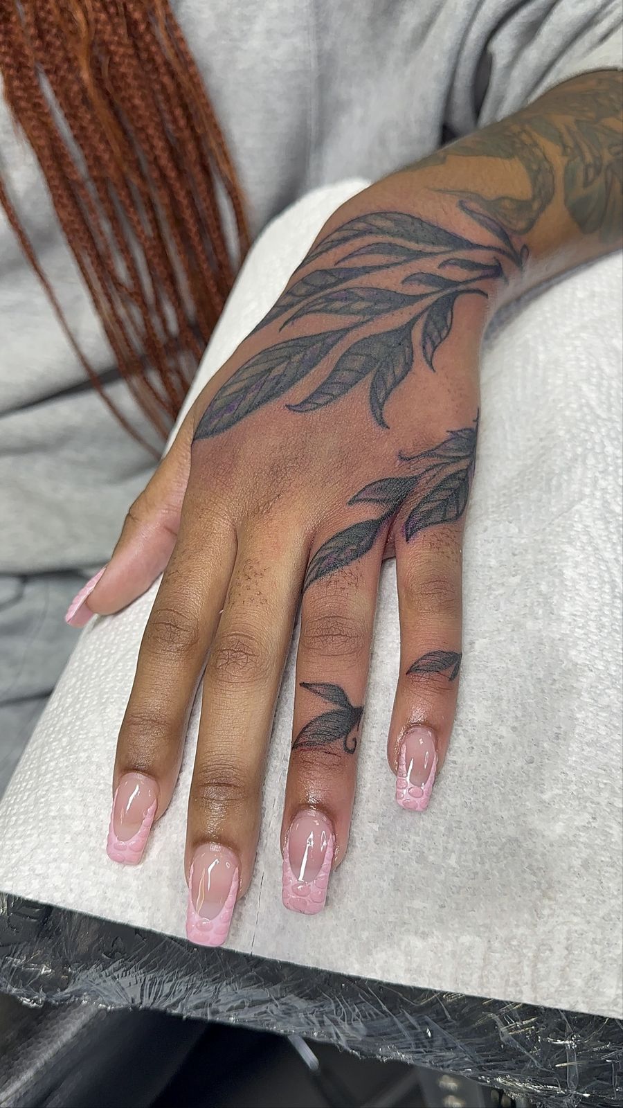 Leafy blackwork hand tattoo